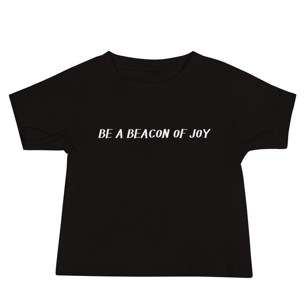 "Be a beacon of joy" printed on a black baby jersey short sleeve tee laying on a flat surface