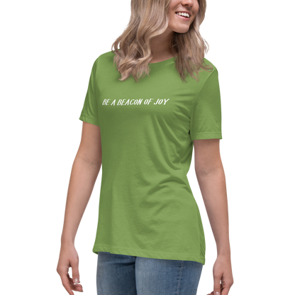 "Be a beacon of joy" printed on a leaf women's relaxed t-shirt worn by a female