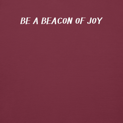 "Be a beacon of joy" printed on a maroon background