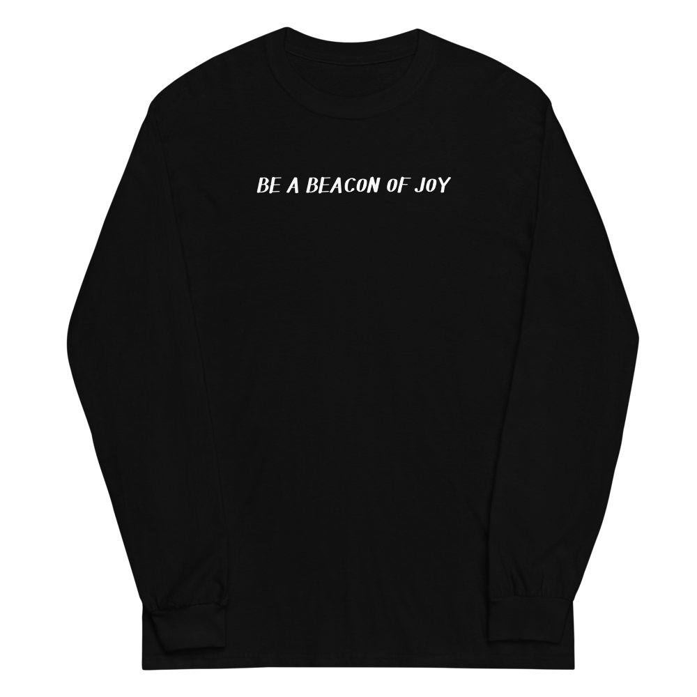 "Be a beacon of joy" printed on a black men's long sleeve shirt laying on a flat surface