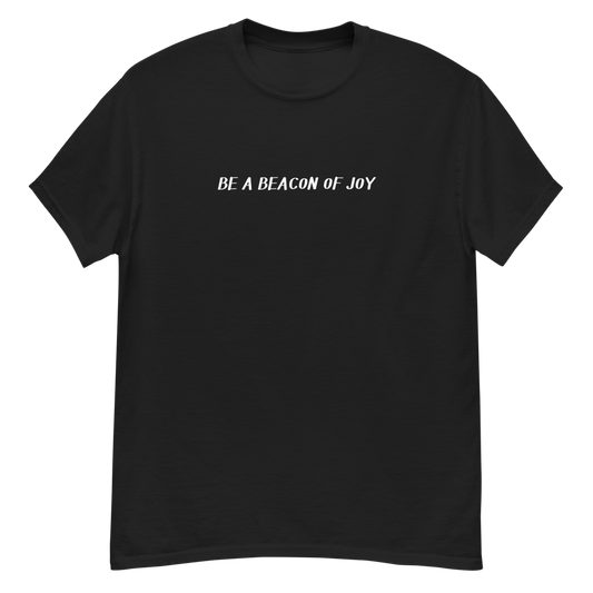"Be a beacon of joy" printed on a black unisex classic tee laying on a flat surface