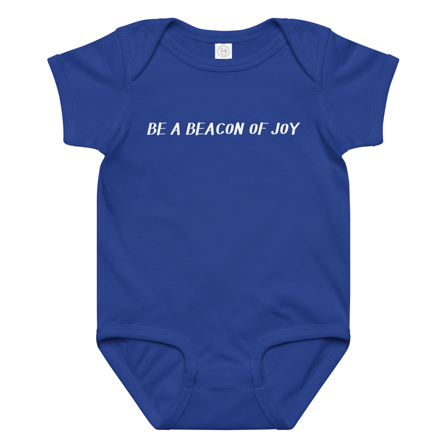 "Be a beacon of joy" printed on a royal baby jersey bodysuit laying on a flat surface amongst other clothes