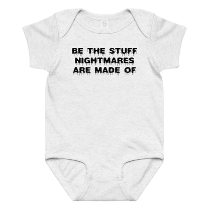 "Be the stuff nightmares are made of" printed on a ash baby jersey bodysuit laying on a flat surface amongst other clothes