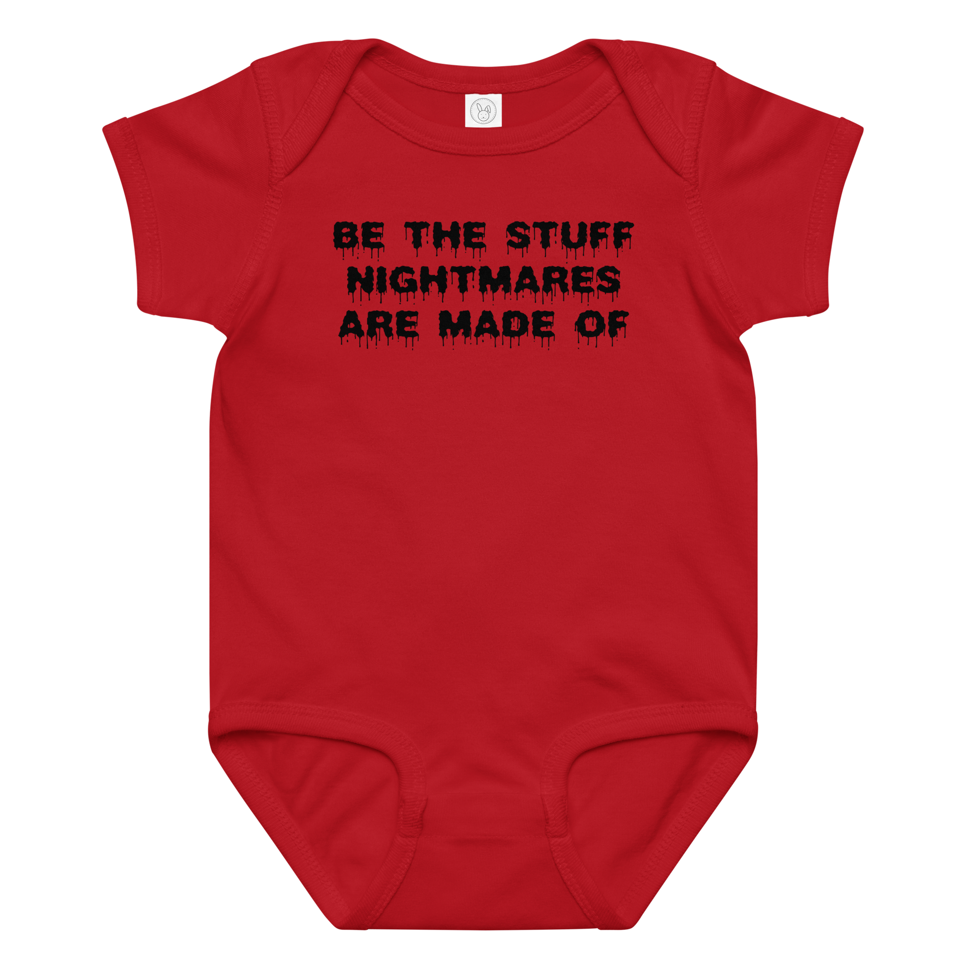 "Be the stuff nightmares are made of" printed on a red baby jersey bodysuit laying on a flat surface amongst other clothes