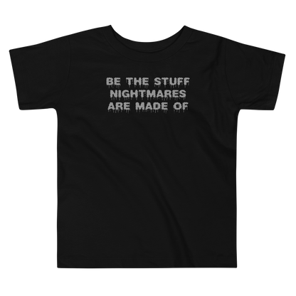 "Be the stuff nightmares are made of" printed on a black toddler short sleeve tee laying on a flat surface