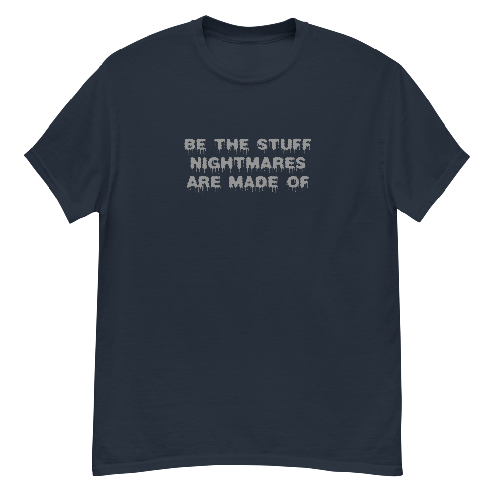 "Be the stuff nightmares are made of" printed on a navy unisex classic tee laying on a flat surface