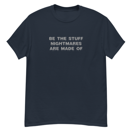 "Be the stuff nightmares are made of" printed on a navy unisex classic tee laying on a flat surface