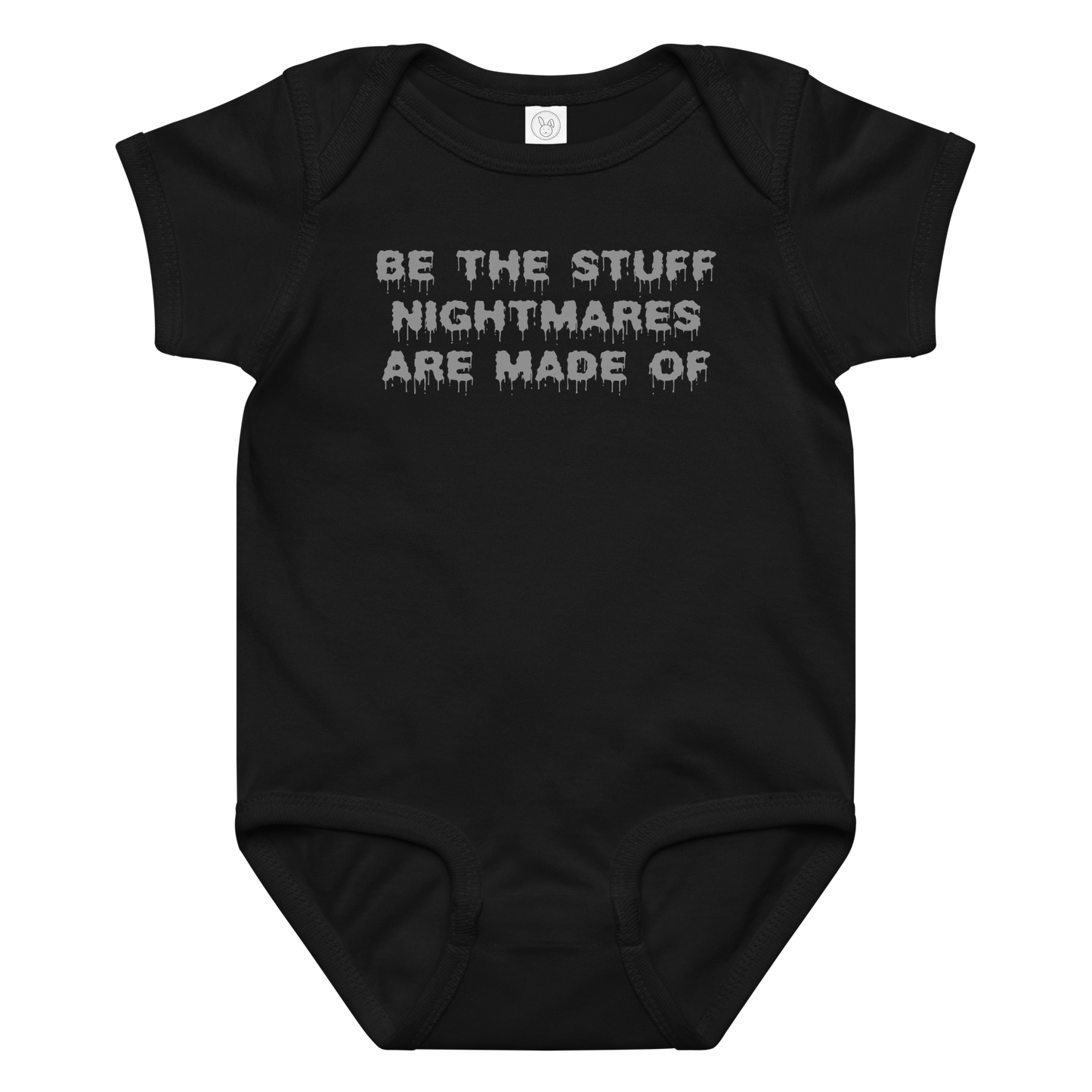 "Be the stuff nightmares are made of" printed on a black baby jersey bodysuit laying on a flat surface amongst other clothes