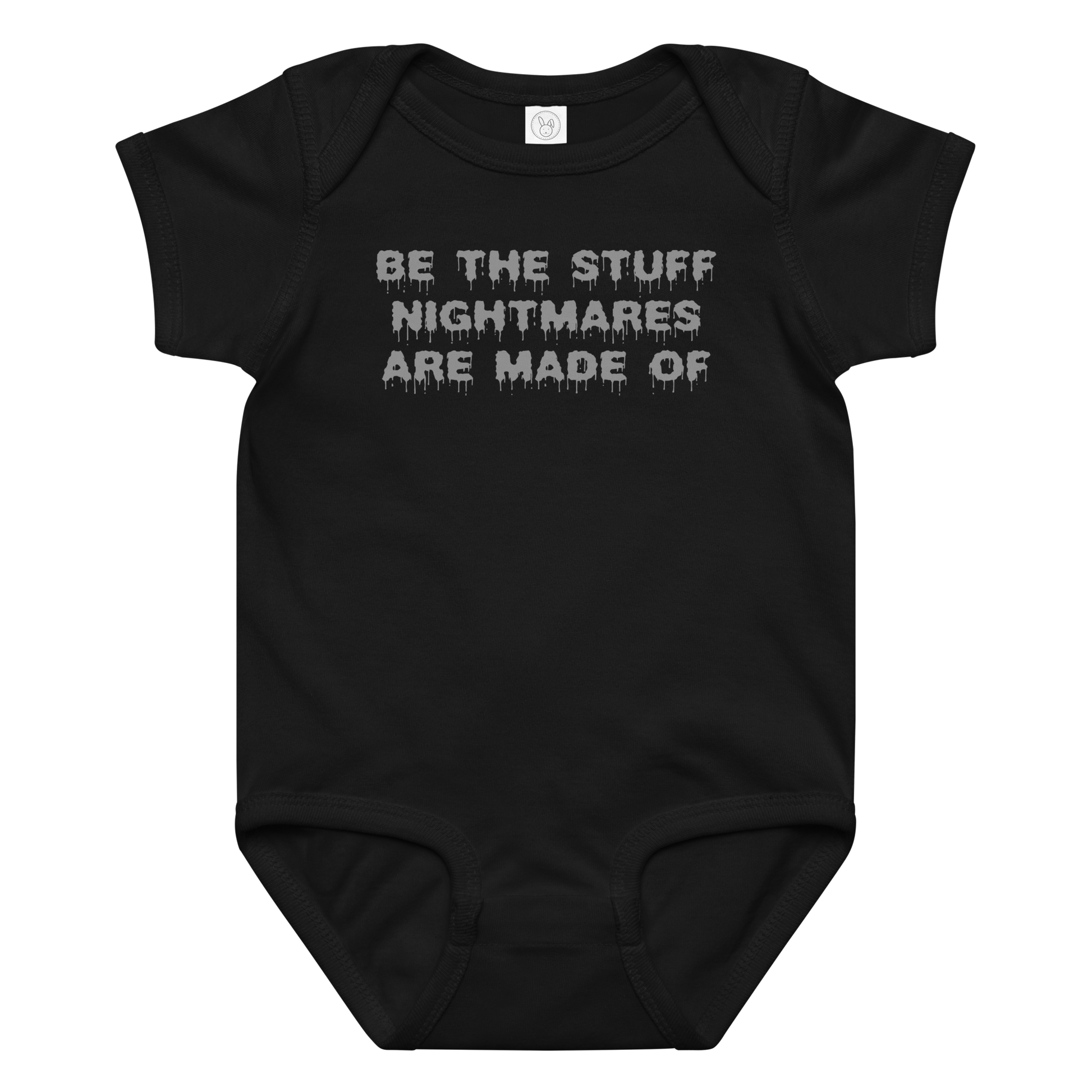 "Be the stuff nightmares are made of" printed on a black baby jersey bodysuit laying on a flat surface amongst other clothes