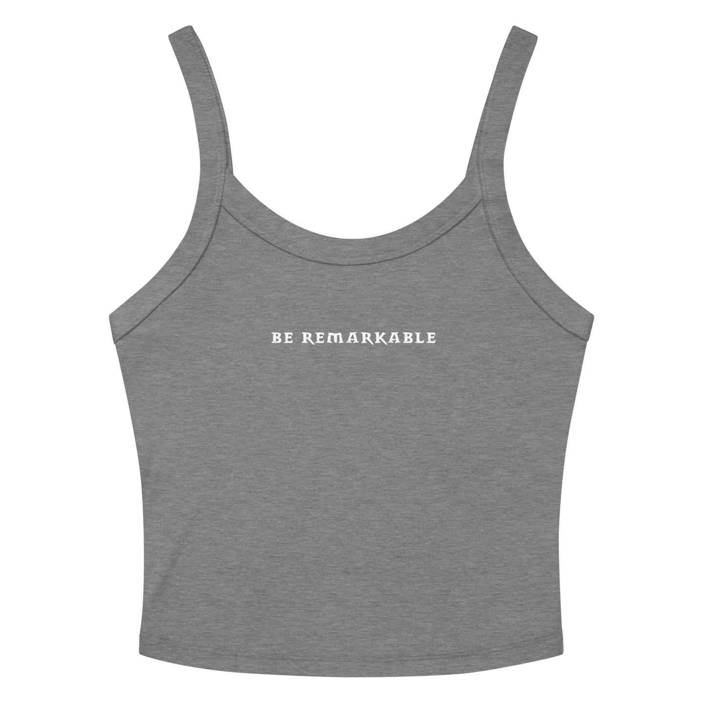 "Be remarkable" printed on a athletic heather women's micro-rib tanktop laying on a flat surface amongst sunglasses and shorts