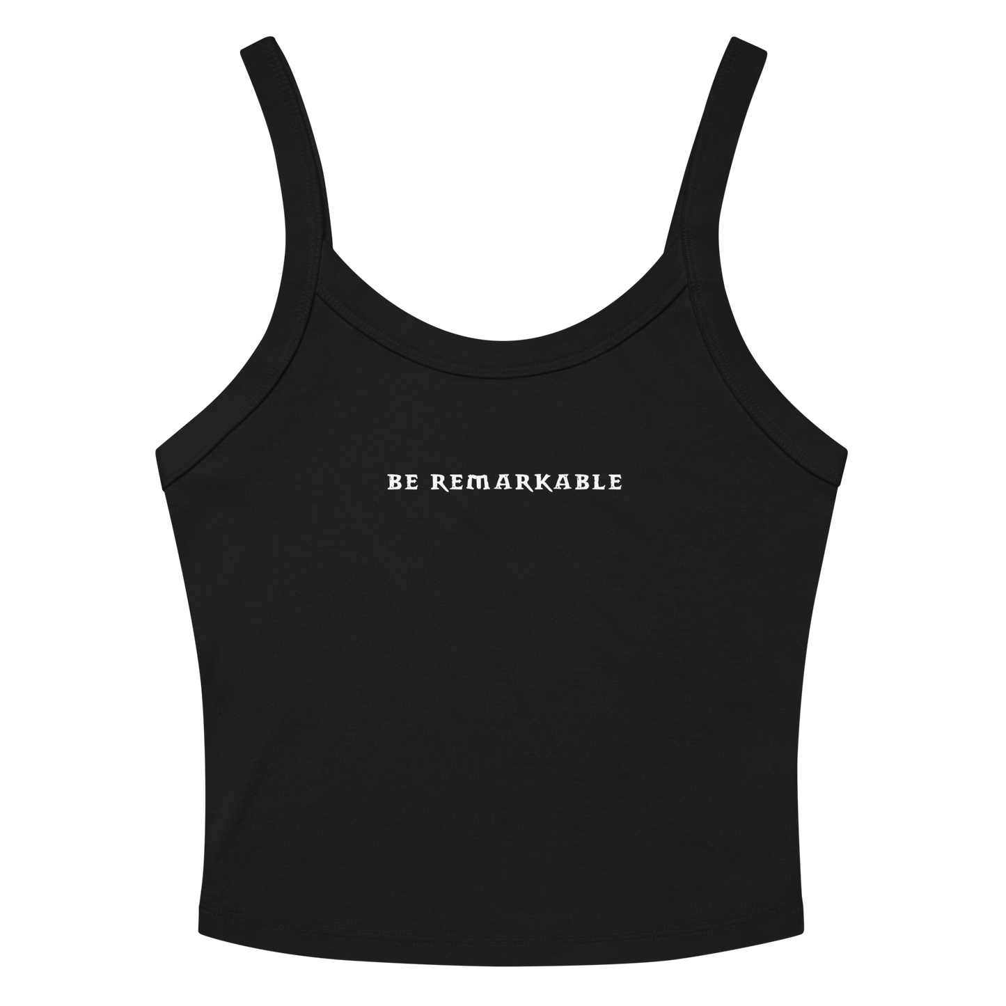 "Be remarkable" printed on a solid black blend women's micro-rib tanktop laying on a flat surface amongst sunglasses and shorts