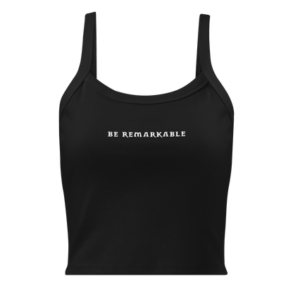 "Be remarkable" printed on a solid black blend women's micro-rib tanktop laying on a flat surface