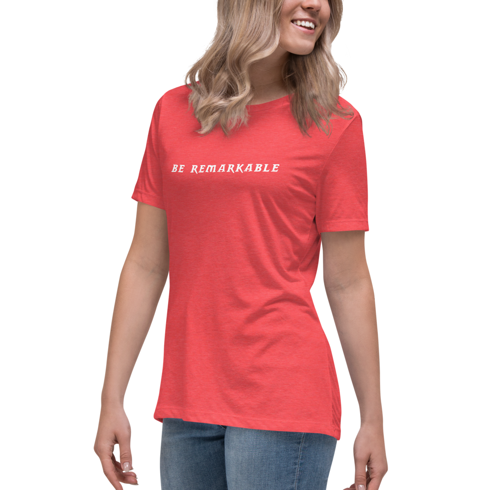 "Be remarkable" printed on a heather red women's relaxed t-shirt worn by a female