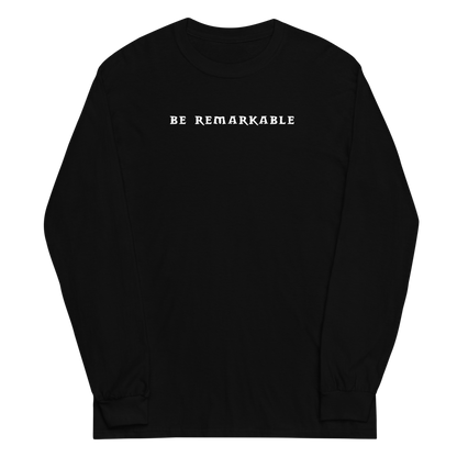 "Be remarkable" printed on a black men's long sleeve shirt laying on a flat surface