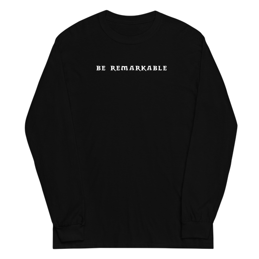 "Be remarkable" printed on a black men's long sleeve shirt laying on a flat surface