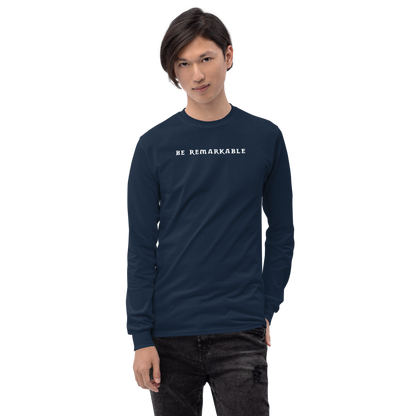 "Be remarkable" printed on a navy men's long sleeve shirt worn by a male