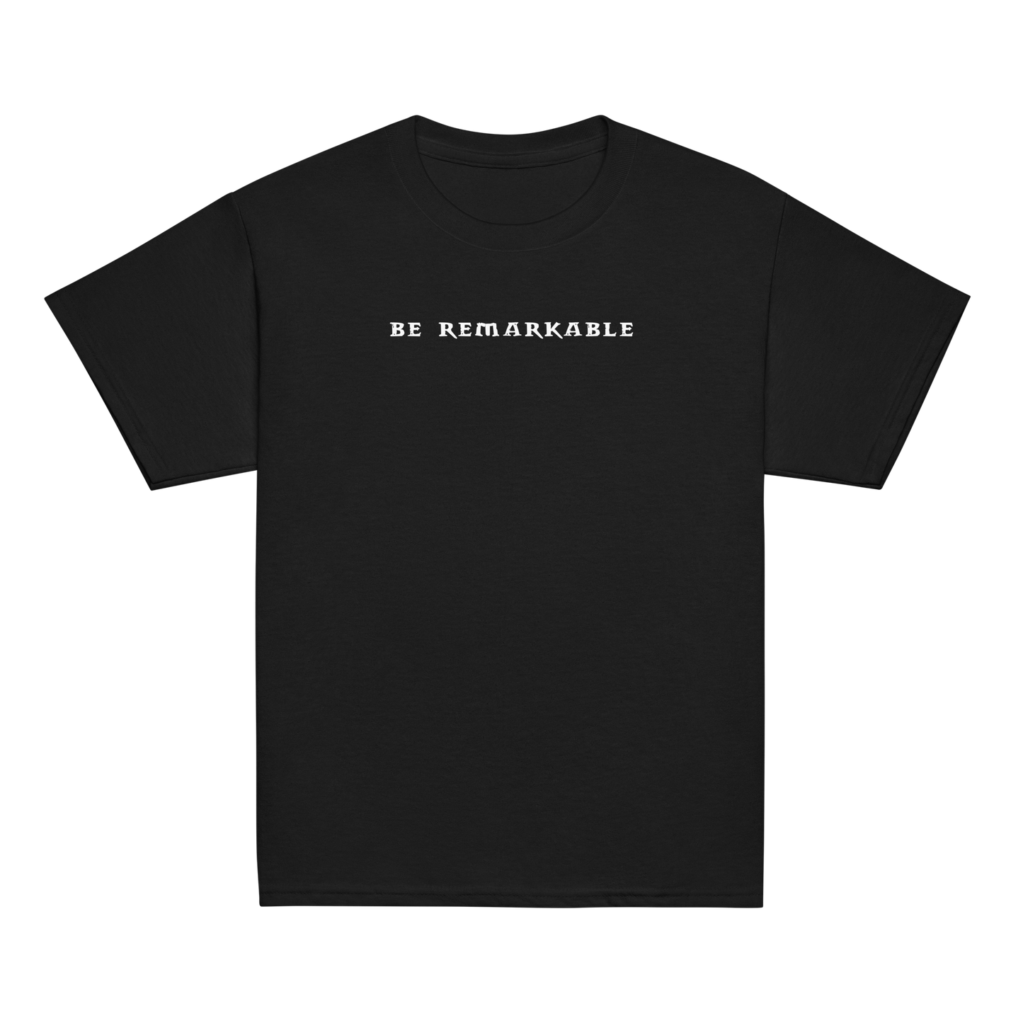 "Be remarkable" printed on a black youth classic tee laying on a flat surface