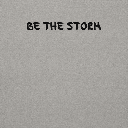 "Be the storm" printed on a carbon grey background