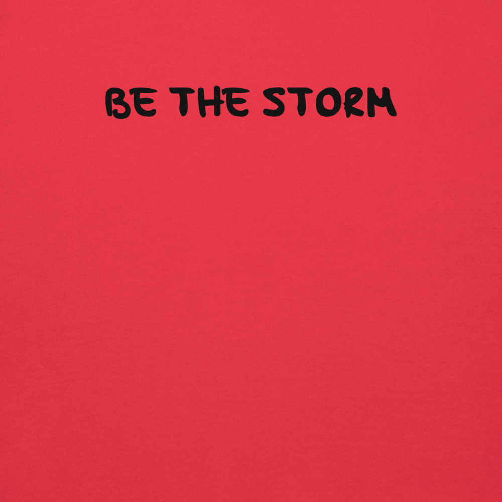 "Be the storm" printed on a team red background