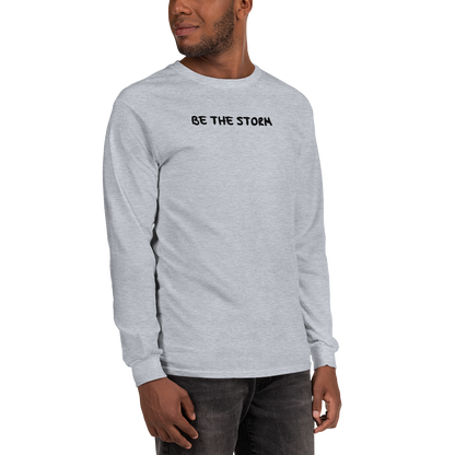 "Be the storm" printed on a sport grey men's long sleeve shirt worn by a male