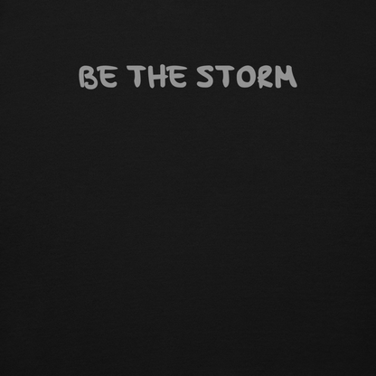 "Be the storm" printed on a black background