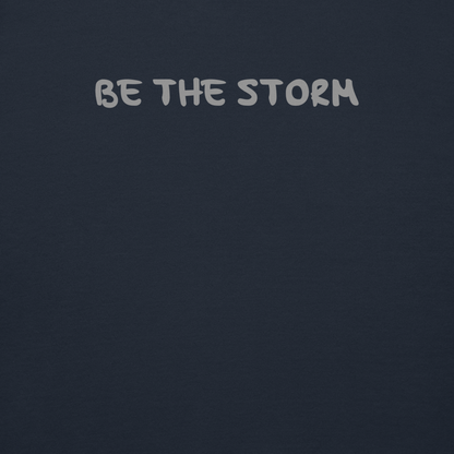 "Be the storm" printed on a navy blazer background