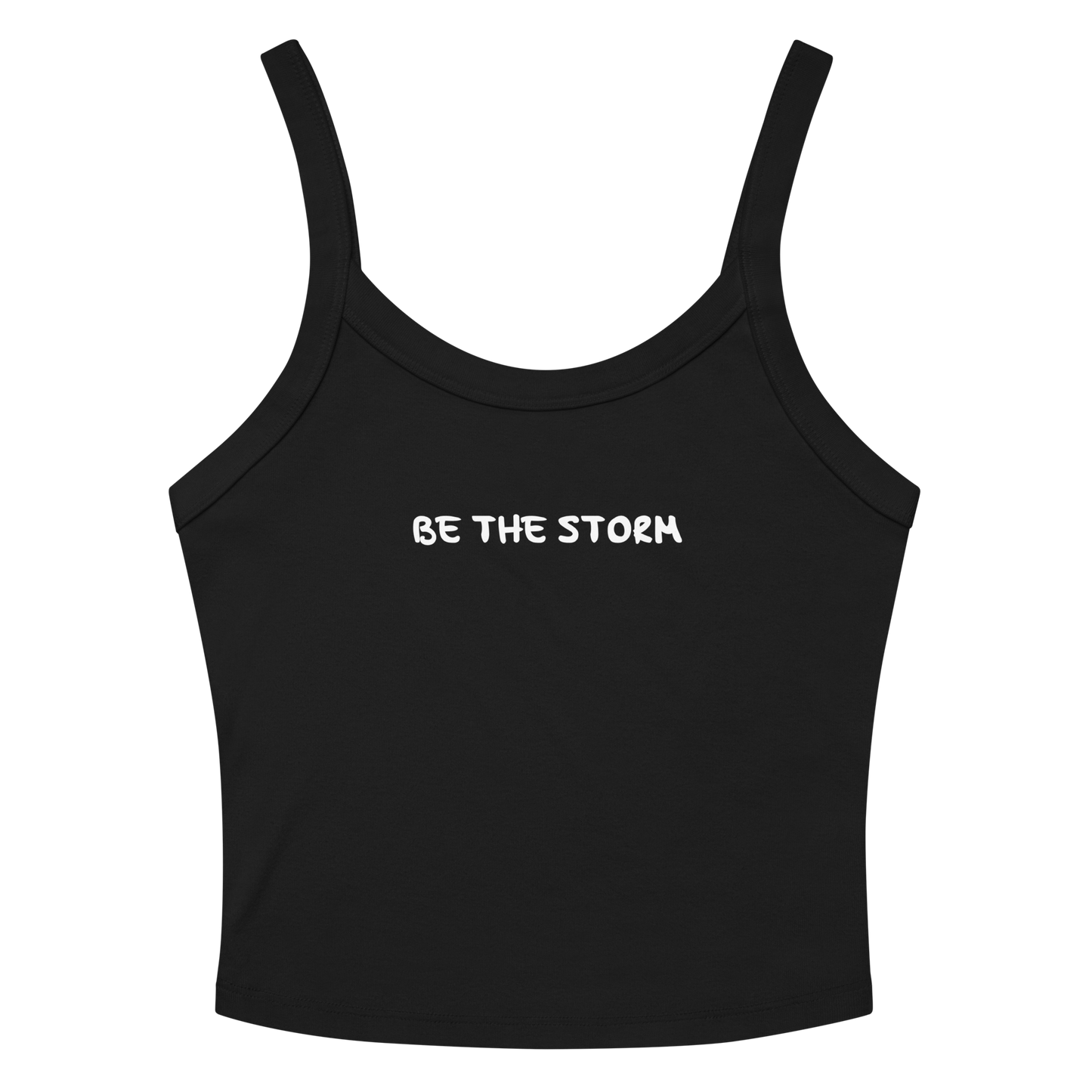 "Be the storm" printed on a solid black blend women's micro-rib tanktop laying on a flat surface amongst sunglasses and shorts