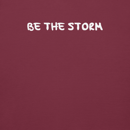 "Be the storm" printed on a maroon background