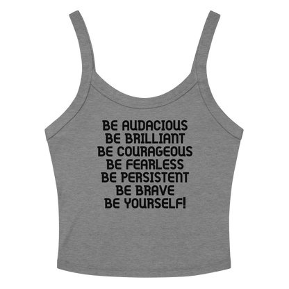 "Be Audacious Be Brilliant Be Courageous Be Fearless Be Persistent Be Brave Be Yourself!" printed on a athletic heather women's micro-rib tanktop laying on a flat surface amongst sunglasses and shorts