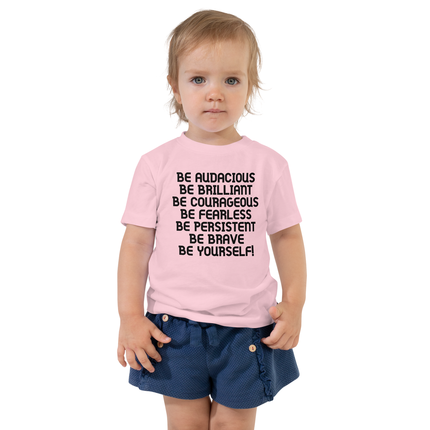 "Be Audacious Be Brilliant Be Courageous Be Fearless Be Persistent Be Brave Be Yourself!" printed on a pink toddler short sleeve tee worn by a female