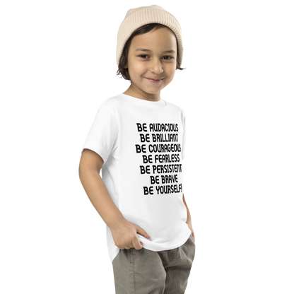 "Be Audacious Be Brilliant Be Courageous Be Fearless Be Persistent Be Brave Be Yourself!" printed on a white toddler short sleeve tee worn by a male who is also wearing a knit cap