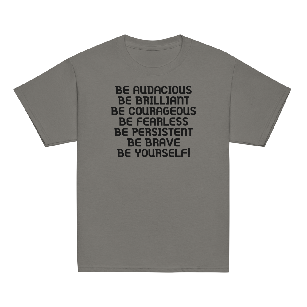 "Be Audacious Be Brilliant Be Courageous Be Fearless Be Persistent Be Brave Be Yourself!" printed on a charcoal youth classic tee laying on a flat surface