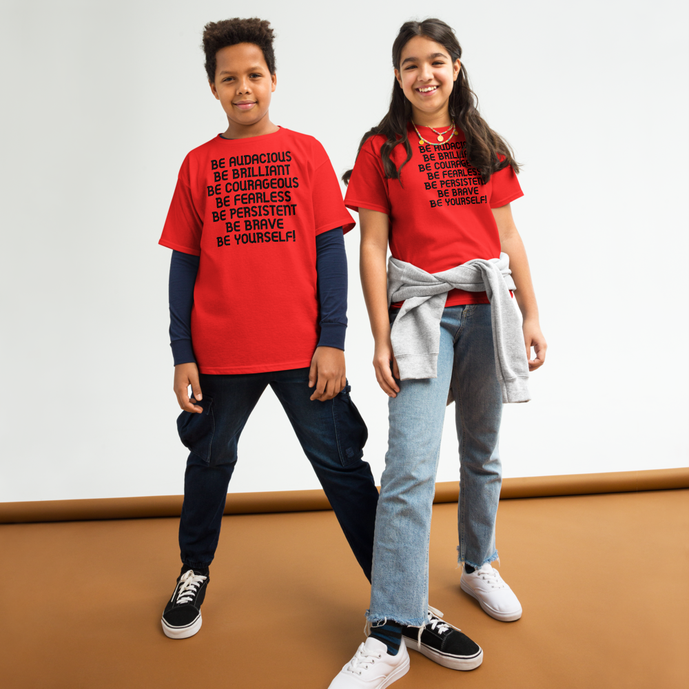 "Be Audacious Be Brilliant Be Courageous Be Fearless Be Persistent Be Brave Be Yourself!" printed on a red youth classic tee worn by a female and male
