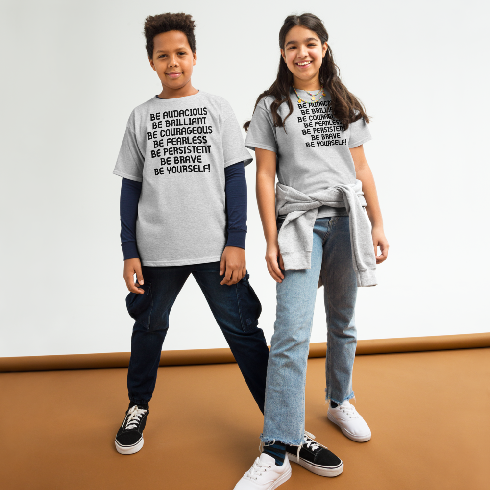 "Be Audacious Be Brilliant Be Courageous Be Fearless Be Persistent Be Brave Be Yourself!" printed on a sport grey youth classic tee worn by a female and male