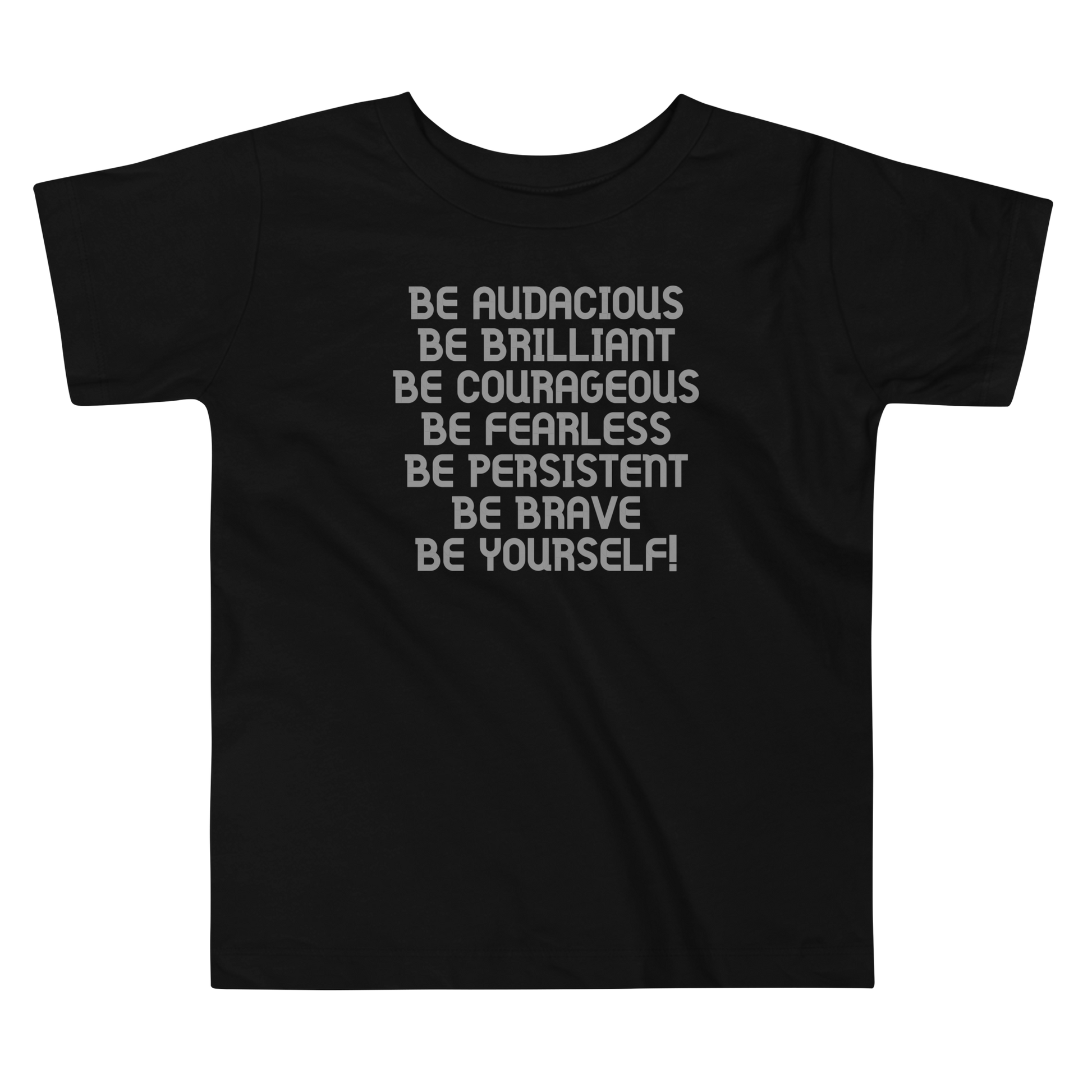 "Be Audacious Be Brilliant Be Courageous Be Fearless Be Persistent Be Brave Be Yourself!" printed on a black toddler short sleeve tee laying on a flat surface