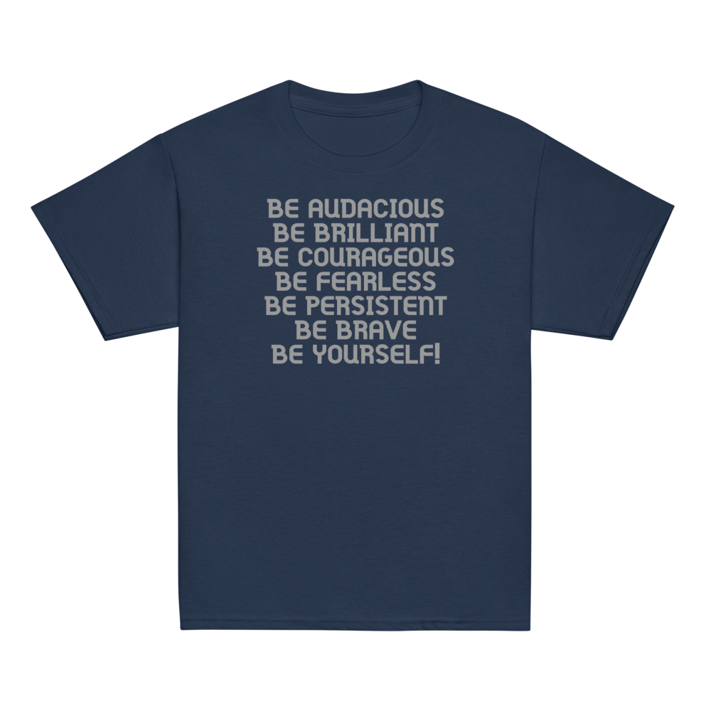"Be Audacious Be Brilliant Be Courageous Be Fearless Be Persistent Be Brave Be Yourself!" printed on a navy youth classic tee laying on a flat surface