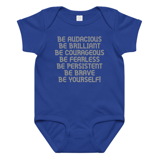 "Be Audacious Be Brilliant Be Courageous Be Fearless Be Persistent Be Brave Be Yourself!" printed on a royal baby jersey bodysuit laying on a flat surface amongst other clothes