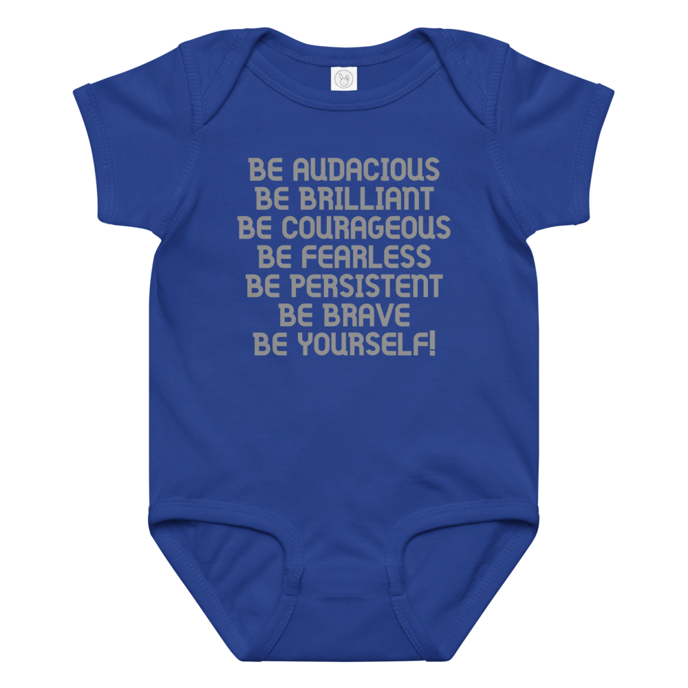 "Be Audacious Be Brilliant Be Courageous Be Fearless Be Persistent Be Brave Be Yourself!" printed on a royal baby jersey bodysuit laying on a flat surface amongst other clothes