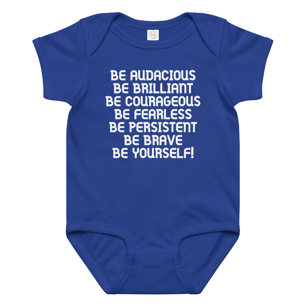 "Be Audacious Be Brilliant Be Courageous Be Fearless Be Persistent Be Brave Be Yourself!" printed on a royal baby jersey bodysuit laying on a flat surface amongst other clothes