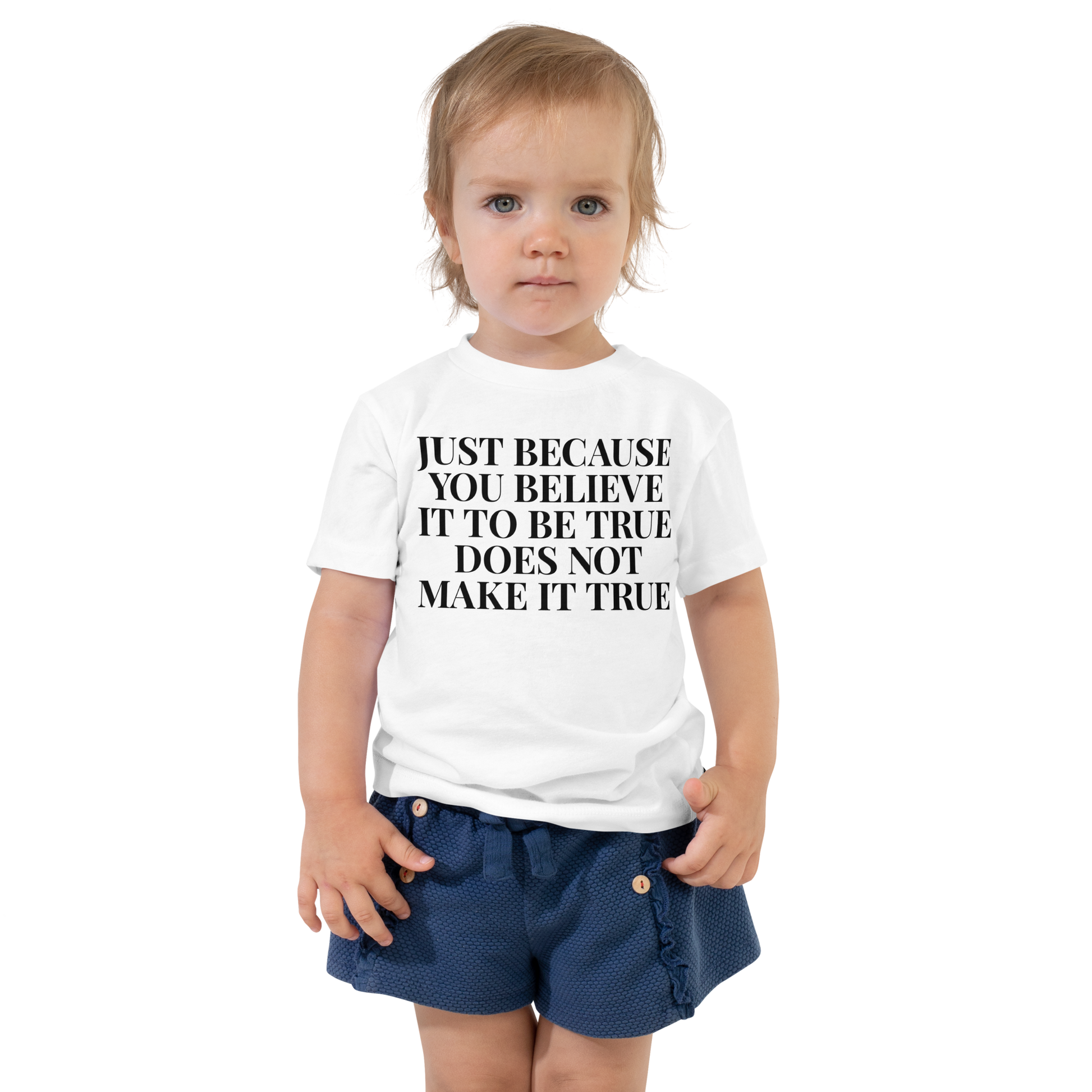 "Just because you believe it to be true does not make it true" printed on a white toddler short sleeve tee worn by a female
