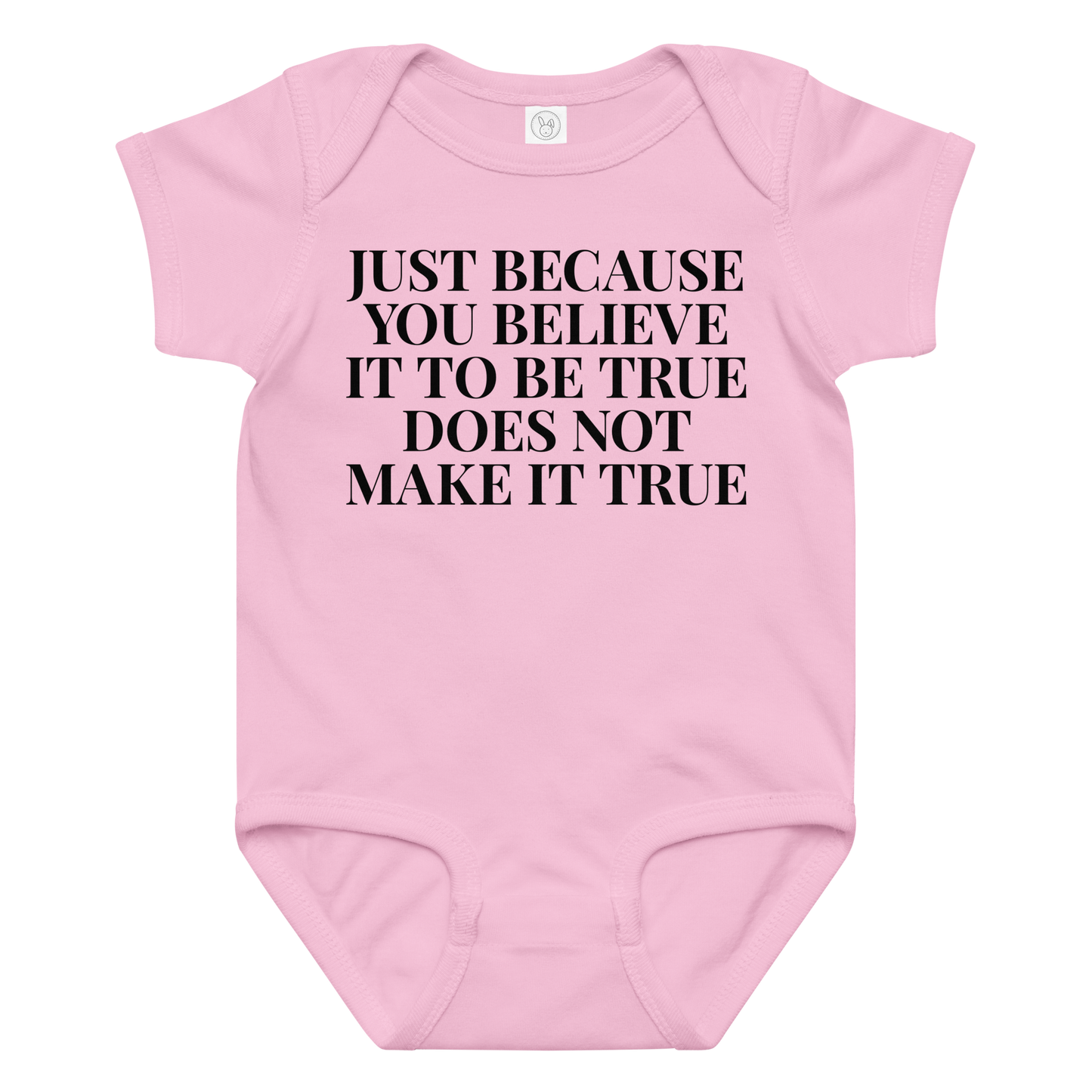 "Just because you believe it to be true does not make it true" printed on a pink baby jersey bodysuit laying on a flat surface amongst other clothes