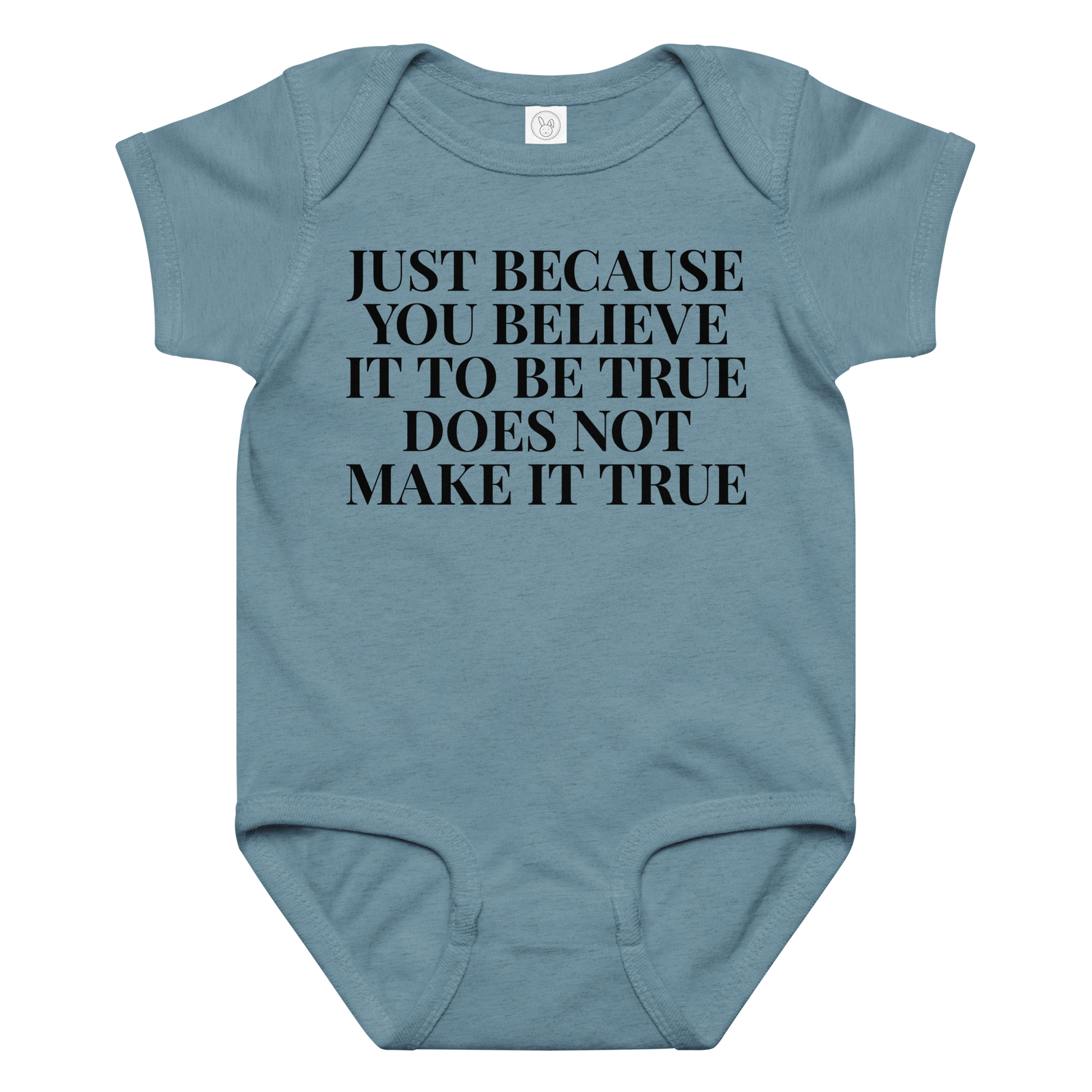 "Just because you believe it to be true does not make it true" printed on a vintage indigo baby jersey bodysuit laying on a flat surface amongst other clothes