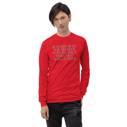 "Just because you believe it to be true does not make it true" printed on a red men's long sleeve shirt worn by a male