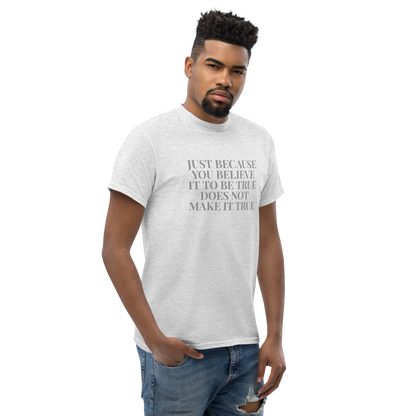 "Just because you believe it to be true does not make it true" printed on a ash unisex classic tee worn by a male