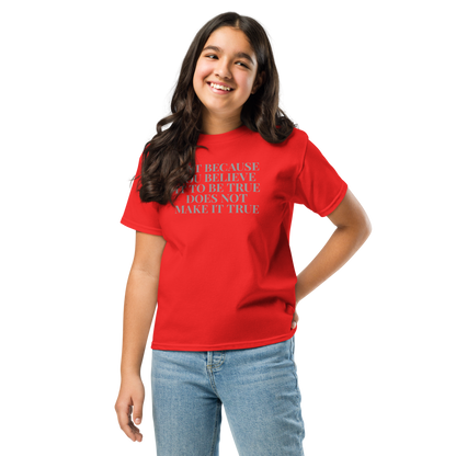 "Just because you believe it to be true does not make it true" printed on a red youth classic tee worn by a female
