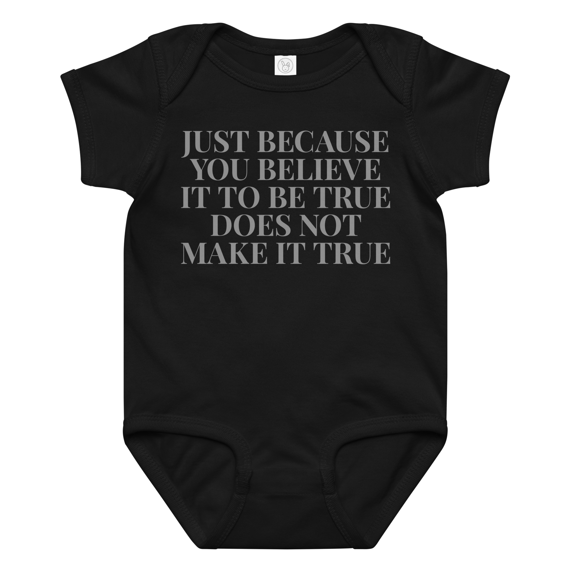 "Just because you believe it to be true does not make it true" printed on a black baby jersey bodysuit laying on a flat surface amongst other clothes