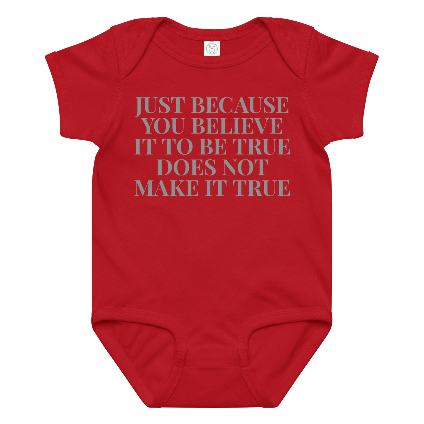 "Just because you believe it to be true does not make it true" printed on a red baby jersey bodysuit laying on a flat surface amongst other clothes