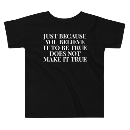 "Just because you believe it to be true does not make it true" printed on a black toddler short sleeve tee laying on a flat surface