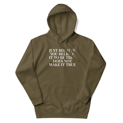 "Just because you believe it to be true does not make it true" printed on a military green unisex hoodie laying on a flat surface with the hood up
