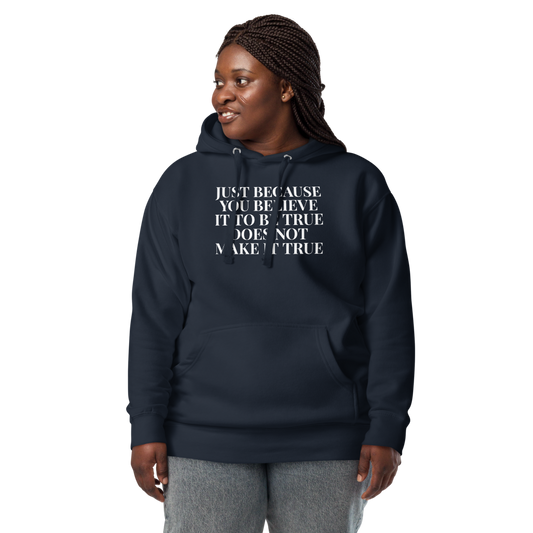 "Just because you believe it to be true does not make it true" printed on a navy blazer unisex hoodie worn by a female
